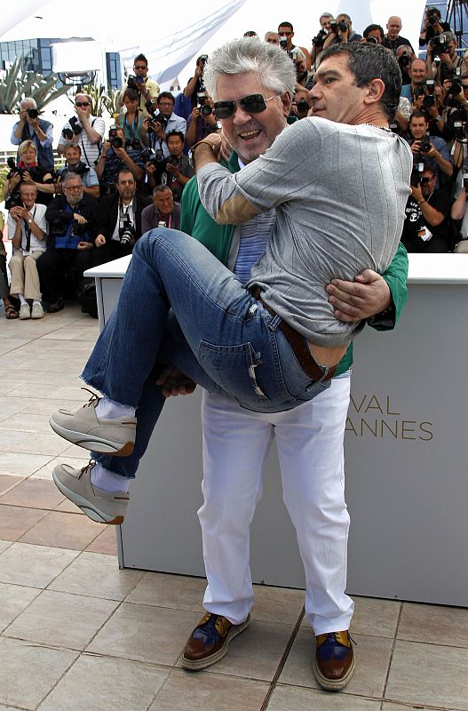 Director Almodovar poses with cast member Banderas during a photocall for the film "La Piel Que Habito",in competition at the 64th Cannes Film Festival