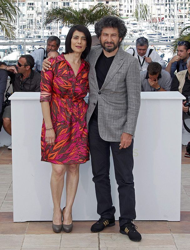 Director Mihaileanu and cast member Abbas pose during a photocall for the film La Source des Femmes at the 64th Cannes Film Festival