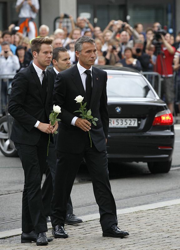 Norwegian PM Jens Stoltenberg and Eskil Pedersen, the leader of the youth wing of ruling Labour Party, arrive to attend a memorial service at a cathedral in Oslo