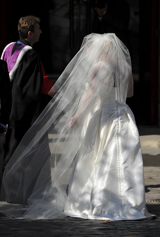 Reverend Neil Gardner leads Britain's Zara Phillips into the church for her marriage to Mike Tindall at Canongate Kirk in Edinburgh