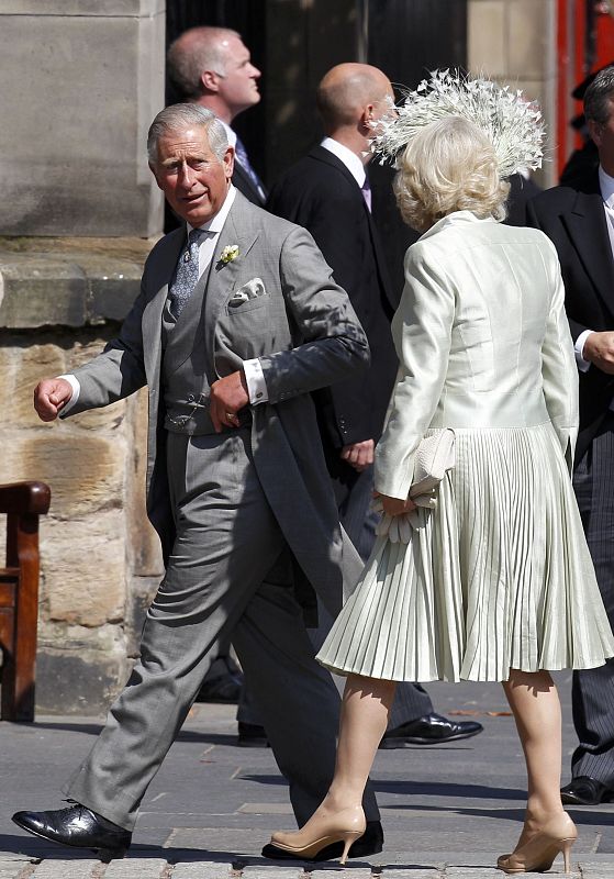 Britain's Prince Charles and his wife Camilla, Duchess of Cornwall arrive for the wedding between Zara Phillips and Mike Tindall at Canongate Kirk in Edinburgh