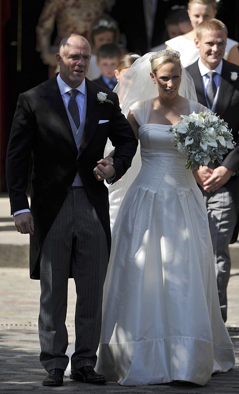 Britain's Zara Phillips and her husband Mike Tindall leave after their marriage at Canongate Kirk in Edinburgh