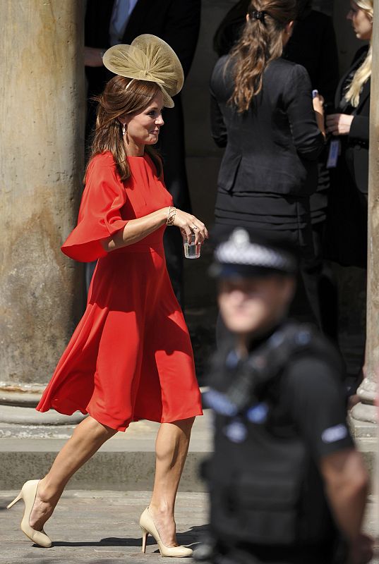 A guest arrives for the wedding between Britain's Zara Phillips and Mike Tindall at Canongate Kirk in Edinburgh