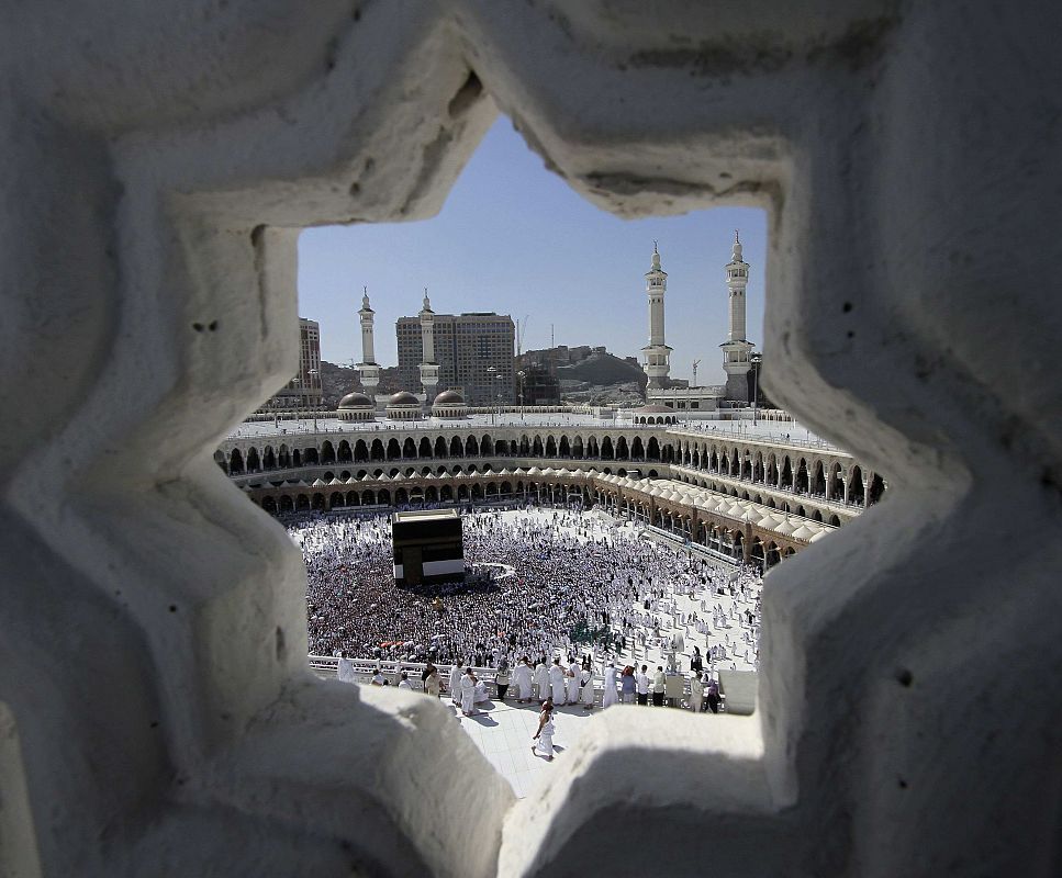 Muslim pilgrims perform Friday prayers around the Kaaba at the Grand Mosque in Mecca