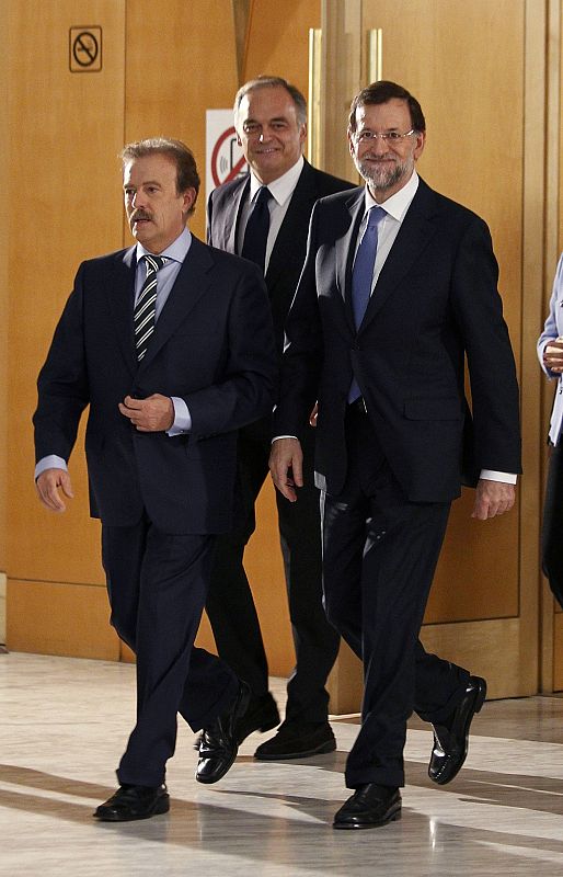 Mariano Rajoy sale del Palacio de Congresos Campo de las Naciones de Madrid junto a Manuel Campo Vidal