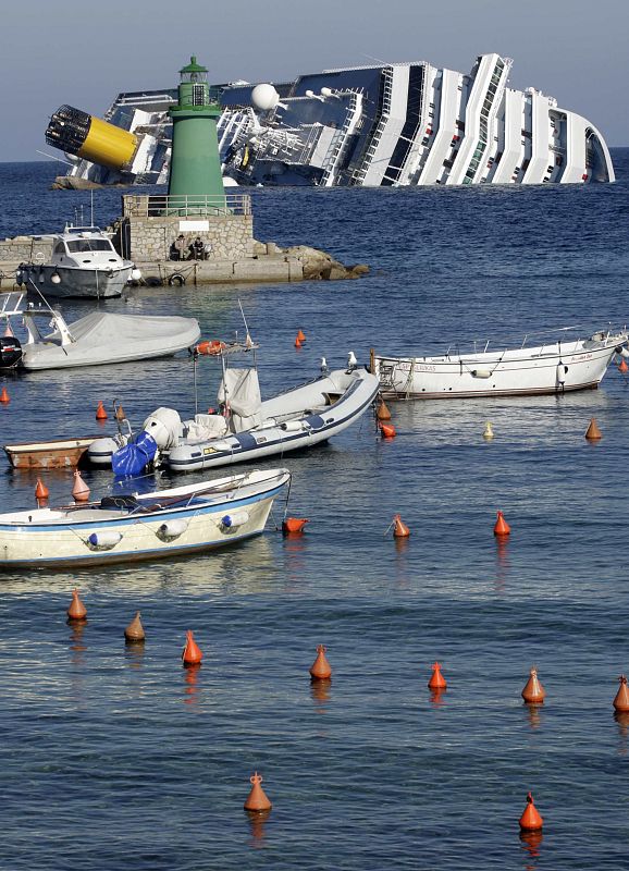 A cruise ship that ran aground is seen off the west coast of Italy at Giglio island