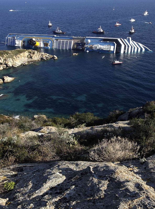 A cruise ship that ran aground is seen off the west coast of Italy at Giglio island