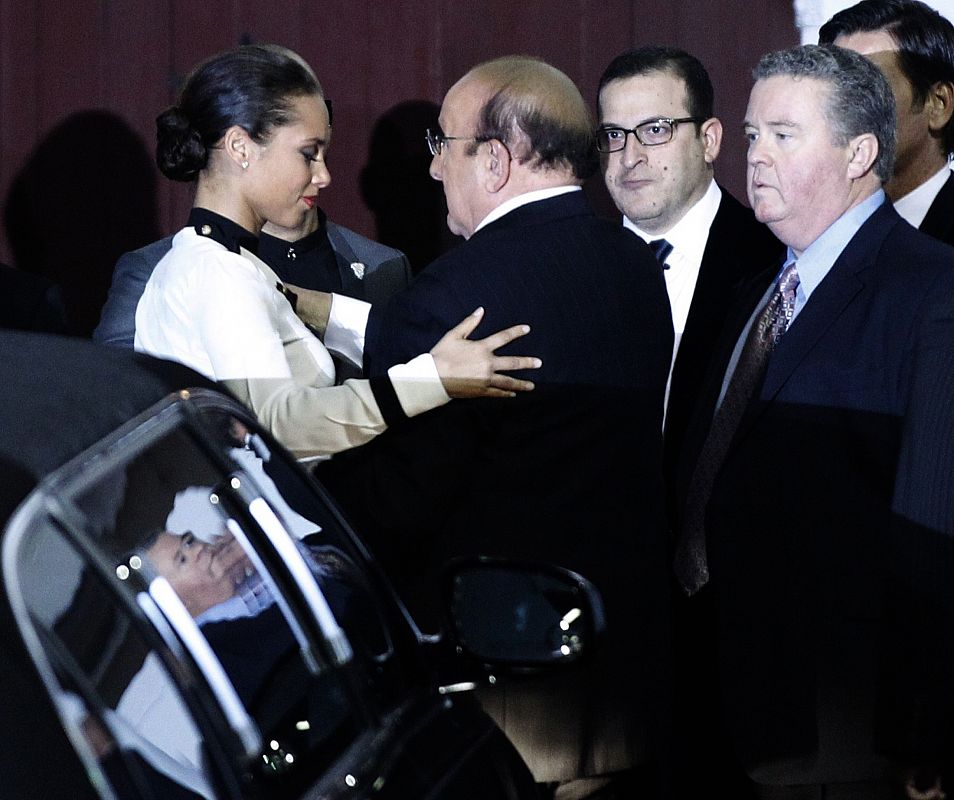 Singer Alicia Keys hugs record producer Clive Davis after Davis arrived for his pre-Grammy gala at the Beverly Hilton Hotel in Beverly Hills