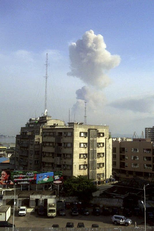 A plume of smoke rises from across the river in neighbouring Republic of Congo's capital Brazzaville, as seen above the skyline of Democratic Republic of Congo's capital Kinshasa