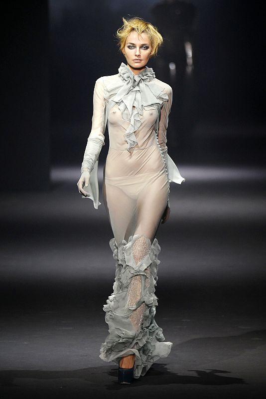 A model presents a creation by designer Bill Gaytten for John Galliano as part of his Fall/Winter 2012-2013 women's ready-to-wear show during Paris fashion week