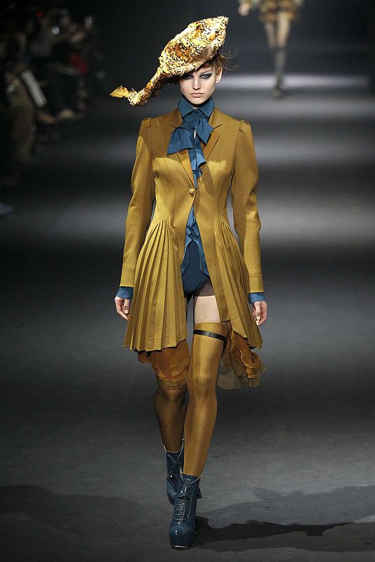 A model presents a creation by designer Bill Gaytten for John Galliano as part of his Fall/Winter 2012-2013 women's ready-to-wear show during Paris fashion week