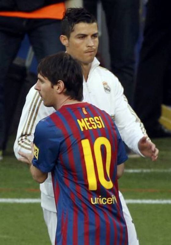 Barcelona's Lionel Messi greets Real Madrid's Ronaldo before their Spanish first division "El Clasico" soccer match