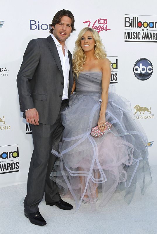 Singer Carrie Underwood and husband, NHL player Mike Fisher, arrive at the 2012 Billboard Music Awards in Las Vegas