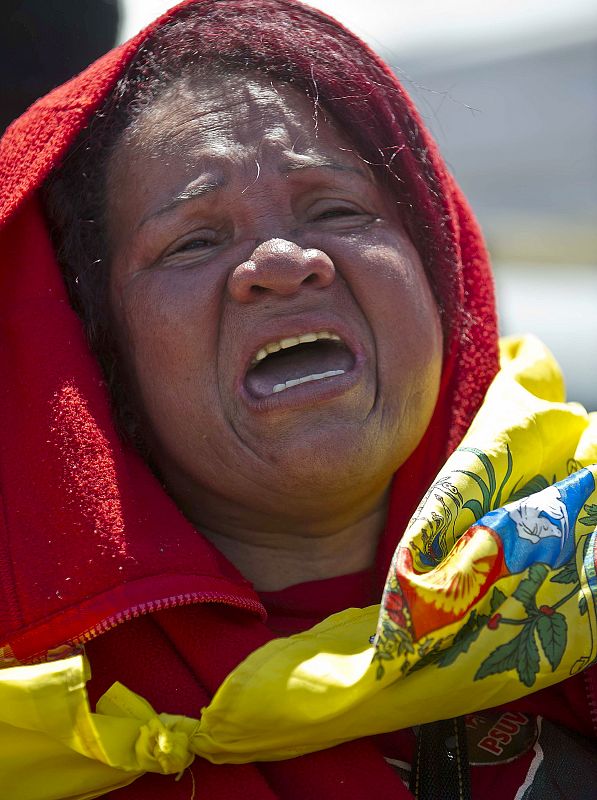 Una mujer llora desconsoladamente durante el funeral de estado por Hugo Chávez en Caracas, Venezuela.