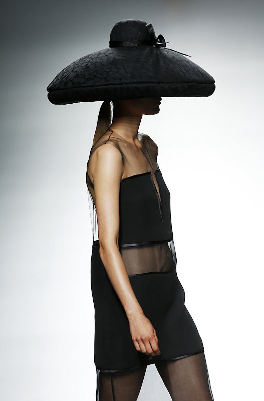 A model presents a creation from the Victorio & Lucchino's Spring/Summer 2014 collection during the Mercedes-Benz Fashion Week in Madrid