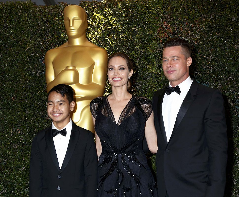 Angelina Jolie and partner Brad Pitt and son Maddox arrive at the 5th Annual Academy of Motion Picture Arts and Sciences Governors Awards in Hollywood