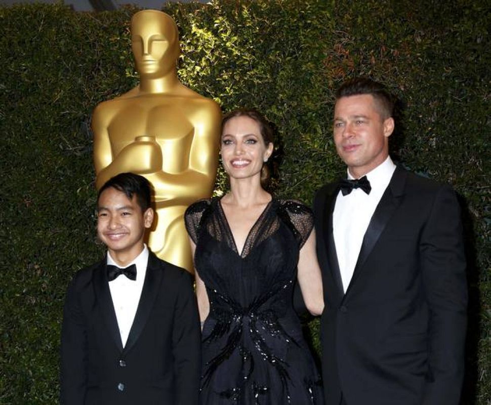 Angelina Jolie and partner Brad Pitt and son Maddox arrive at the 5th Annual Academy of Motion Picture Arts and Sciences Governors Awards in Hollywood 