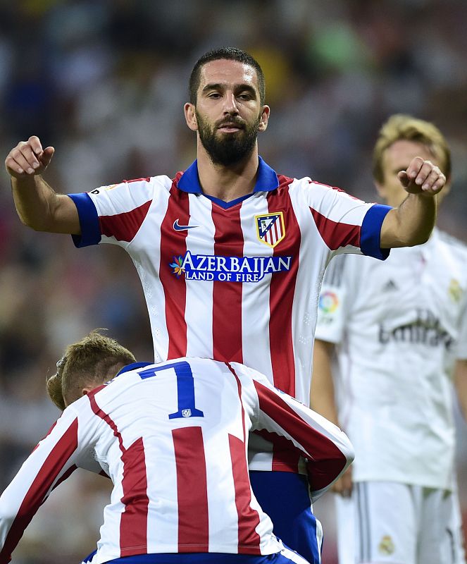 El jugador del Atlético Arda Turan celebra su gol, el de la victoria ante el Real Madrid.