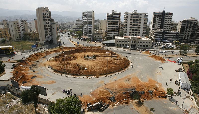 Sand and barricades set by Hezbollah supporters block Tayouneh square a main entrance to Beirut