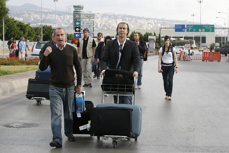 Passengers leave Beirut's international airport on foot