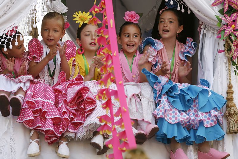 Pilgrims from the Triana brotherhood ride in a carriage as they make their way to the shrine of El Rocio in Seville