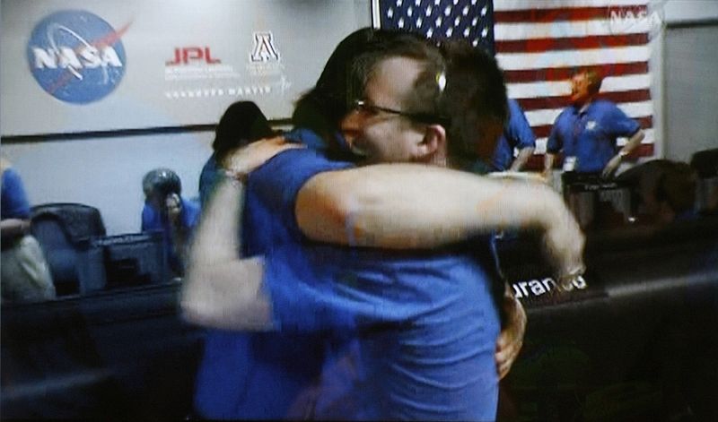 Scientists celebrate successful landing at NASA's Jet Propulsion Laboratory in Pasadena, California