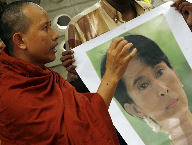 A Burmese Buddhist monk speaks during a protest outside the Myanmar embassy in Colombo