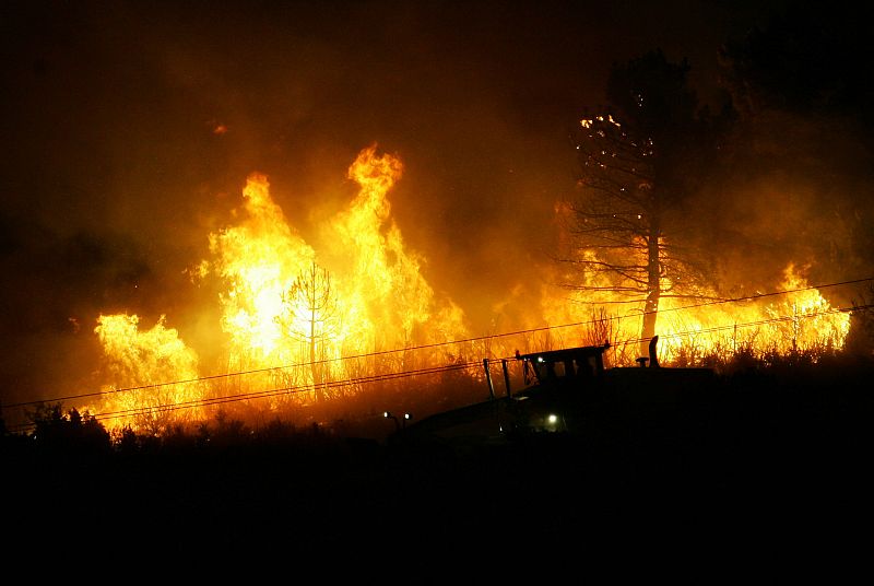 A forest fire rages near the Spanish town of Santa Maria del Espino near Guadalajara.