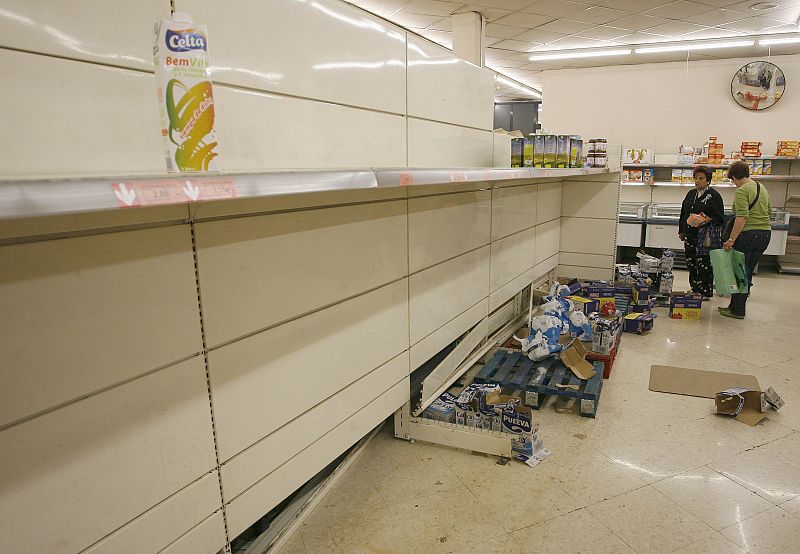 Empty shelves are seen in a supermarket in Valencia