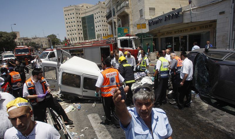 Israeli rescue workers survey scene of attack in Jerusalem