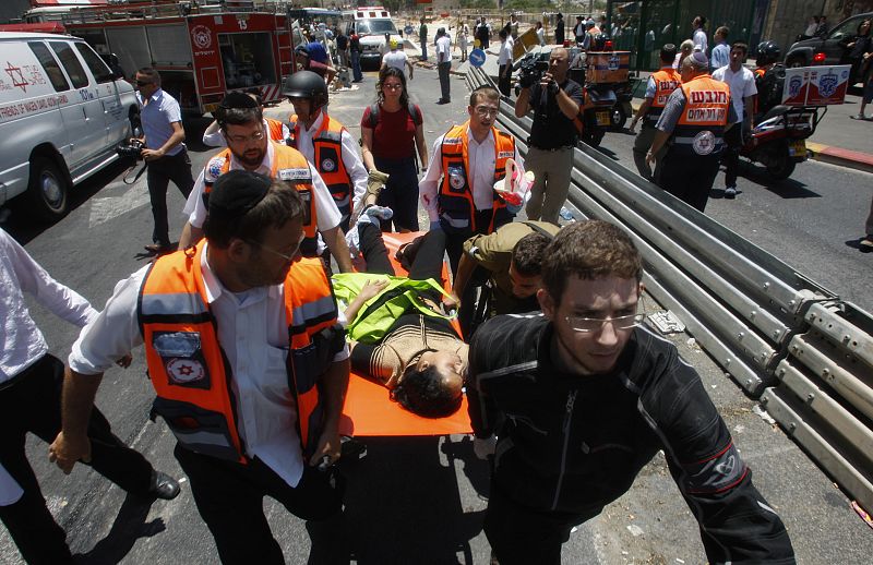 Israeli medics evacuate woman from scene of attack in Jerusalem