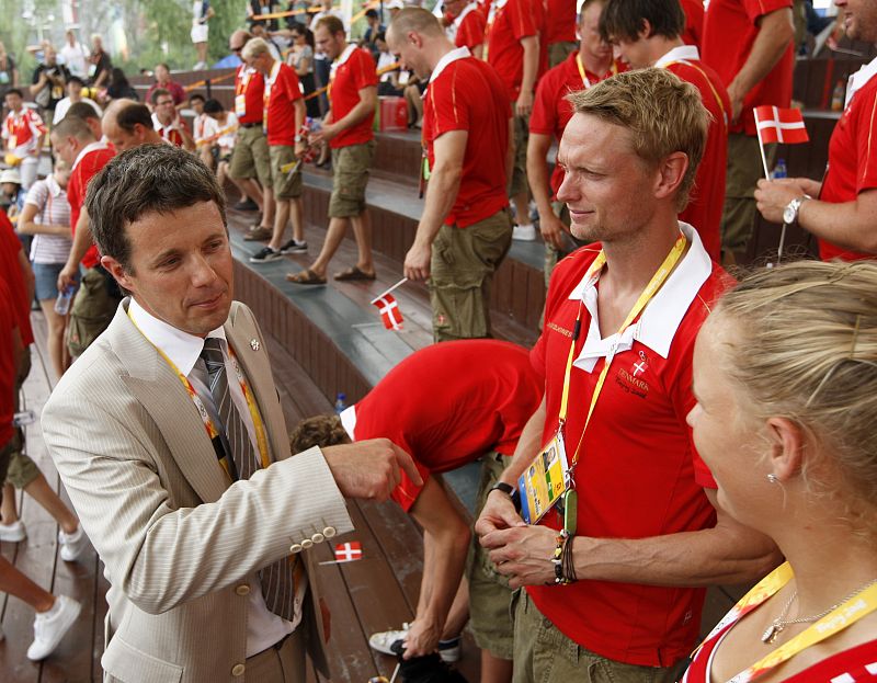 Denmark's Crown Prince Frederik speaks with athletes during the official flag raising ceremony in the Olympic Village ahead of the Beijing 2008 Olympic Games