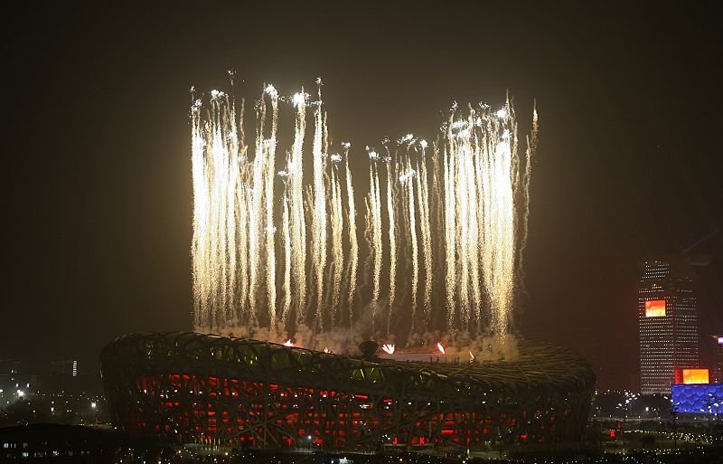 Fireworks illuminate the sky over the National Stadium during the opening ceremony of the Beijing 2008 Olympic Games