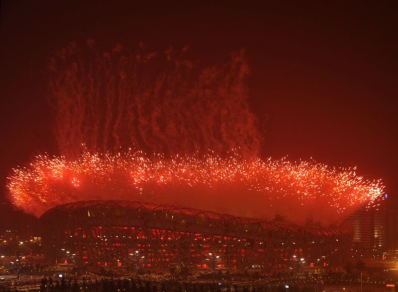 Fireworks illuminate the sky over the National Stadium during the opening ceremony of the Beijing 2008 Olympic Games