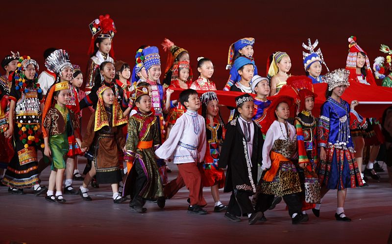 Children carry the flag of China during the opening ceremony of the Beijing 2008 Olympic Games at the National Stadium