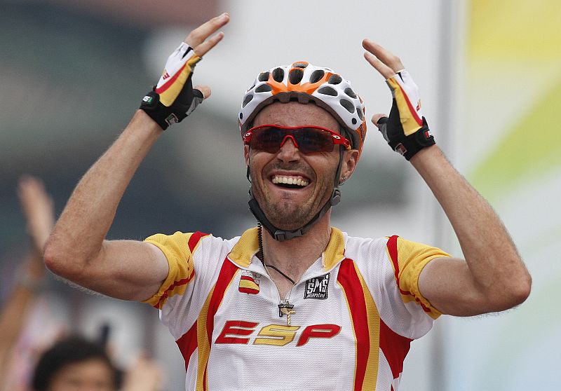 Samuel Sanchez of Spain crosses the finish line to win the men's road cycling competition at the Beijing 2008 Olympic Games