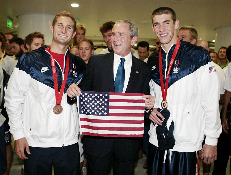 U.S. President Bush poses for a photo with the Beijing 2008 Olympic men's 400m individual medley gold medalist Michael Phelps and men's 400m freestyle bronze medalist Larsen Jensen at the National Aquatics Center in Beijing