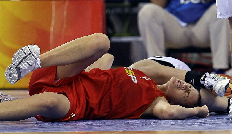 Spain's Nicholls falls to the court during their women's preliminary round group B basketball game against New Zealand at the Beijing 2008 Olympic Games