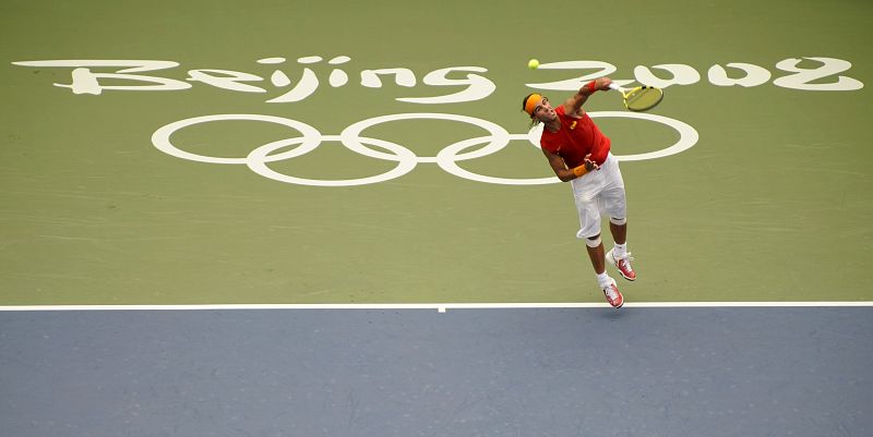 Rafael Nadal of Spain serves to Potito Starace of Italy during their men's first round tennis match at the Beijing 2008 Olympic Games