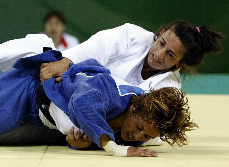 Fernandez of Spain fights with Gotay of the U.S.during their women's -57kg preliminary judo match  at the Beijing 2008 Olympic Games