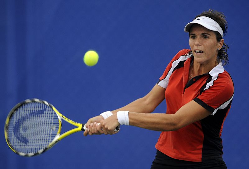 Maria Jose Martinez Sanchez of Spain returns a shot against Alicia Molik of Australia during their women's first round tennis match at the Beijing 2008 Olympic Games