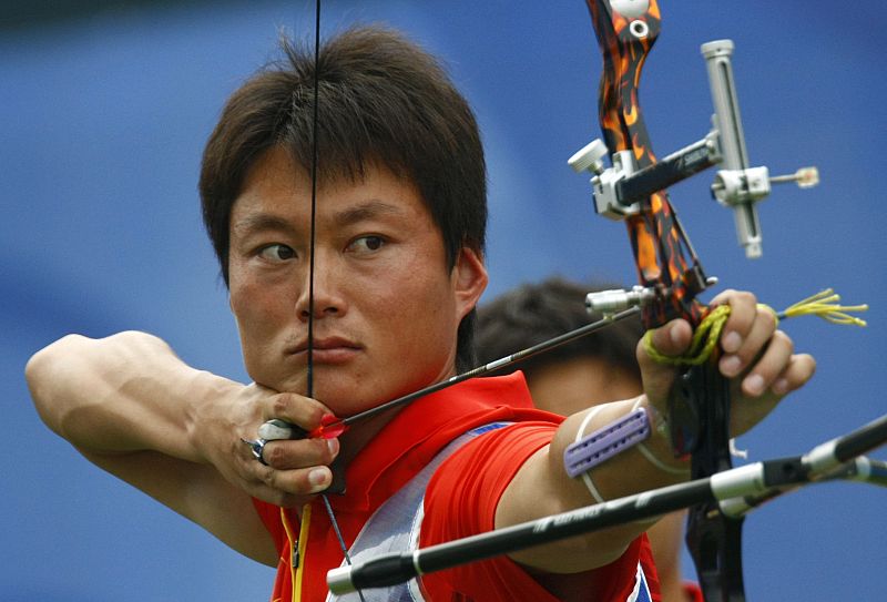 Jiang of China takes aim during their men's team 1/4 elimination archery match against Russia at the Beijing 2008 Olympic Games