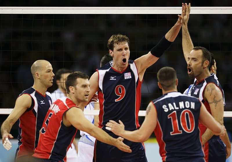 Members of the U.S. team gather during their men's preliminary pool A volleyball match against Italy at the Beijing 2008 Olympic Games