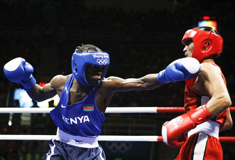 Irungu of Kenya fights Doniyorov of Uzbekistan during their men's flyweight (51kg) round of 32 boxing match at the Beijing 2008 Olympic Games