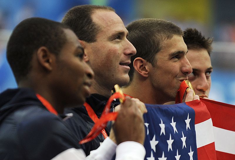 Phelps, Weber-Gale, Jones and Lezak of the U.S. celebrate with their gold medals after winning the men's 4x100m freestyle relay swimming final at the Beijing 2008 Olympic Games