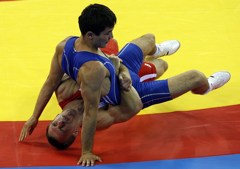 Marcus Thaetner of  Germany fights Darkhan Bayakhmetov of Kazakhstan during their 66 kg men's Greco-Roman wrestling 1/8 final match at the Beijing 2008 Olympic Games