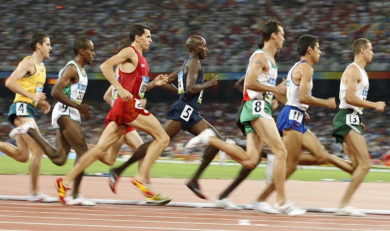 Competitors run in the men's 1500m heat of the athletics competition in the Beijing 2008 Olympic Games at the National Stadium