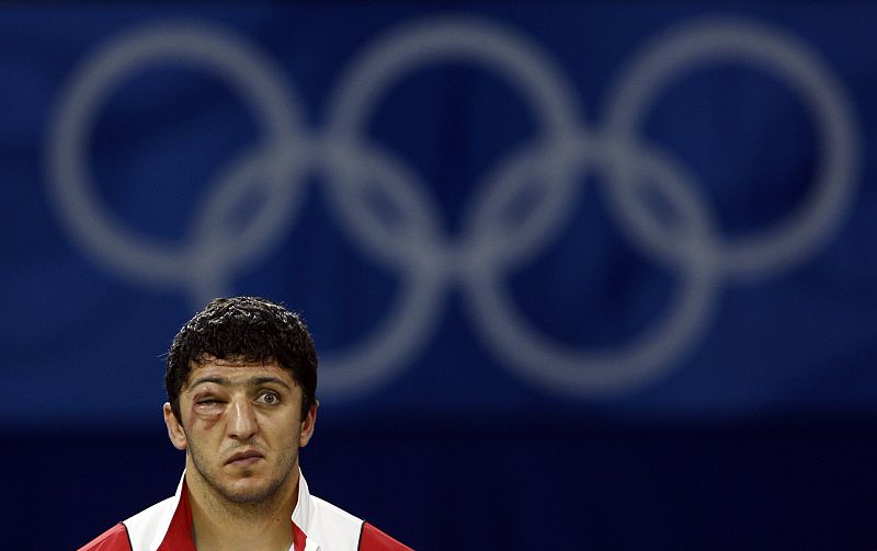 Bronze medallist George Gogshelidze of Georgia attends the medal ceremony for the 96kg men's freestyle wrestling at the Beijing 2008 Olympic Games