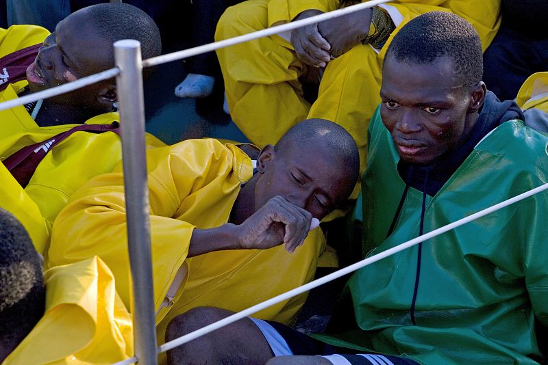 Would-be immigrants sit aboard a Spanish civil guard boat at the port of Arguineguin in Spain's Canary Island of Gran Canaria