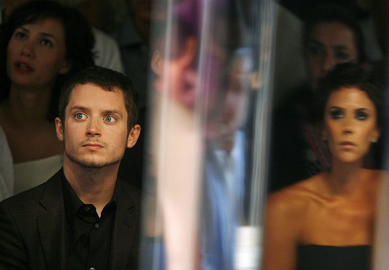 Elijah Wood watches models present creations during the Spring 2009 Marc Jacobs show during New York Fashion Week